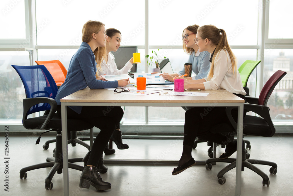 Group of young businesswomen working together