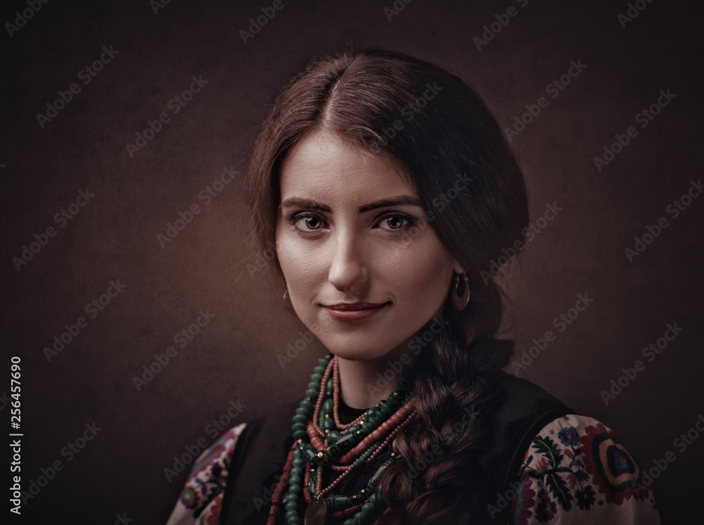 Beauty female portrait with ethnic ukrainian dress and accessories Beauty female portrait with ethnic ukrainian dress and accessories