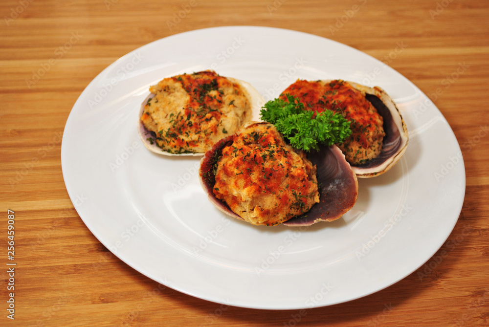 Appetizer of Stuffed Clams Garnished with Curly Parsley Appetizer of Stuffed Clams Garnished with Curly Parsley