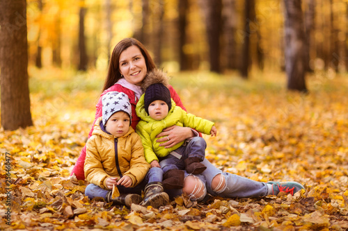 brunette mom with two sons beautiful family autumn
