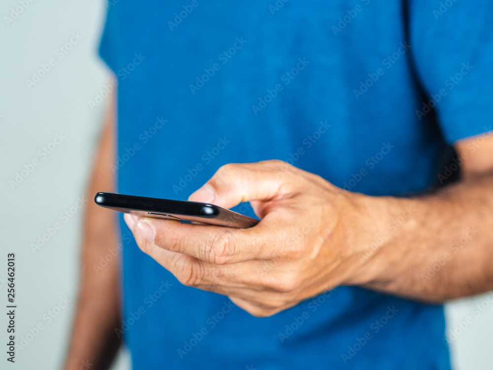 Closeup of young man using smartphone isolated on a white background Closeup of young man using smartphone isolated on a white background