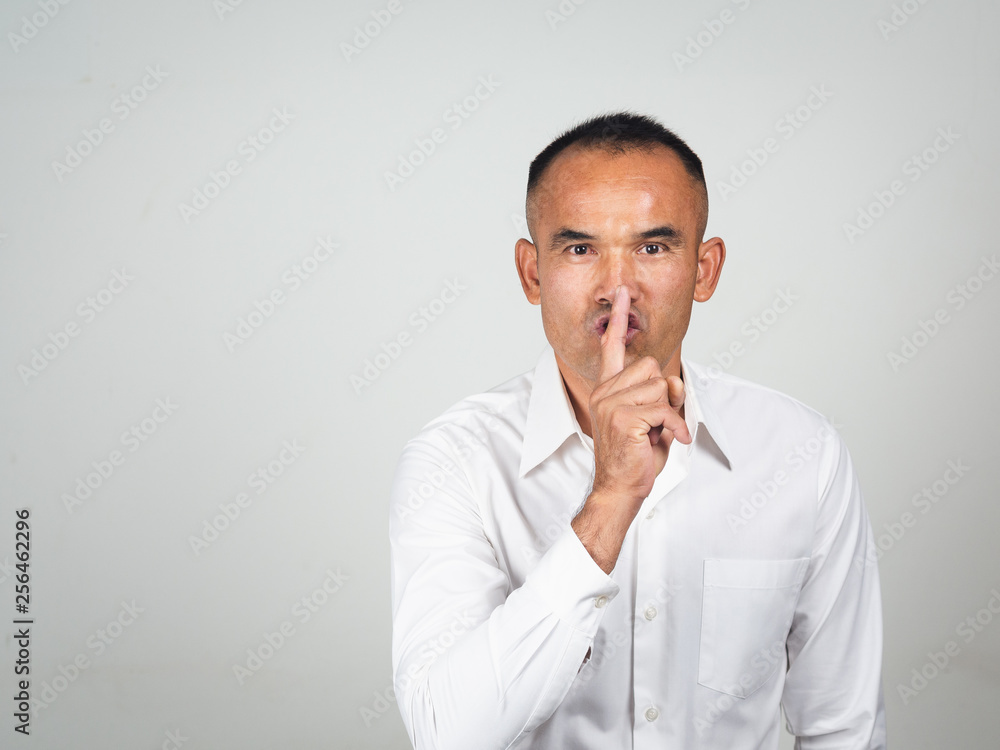 The man making finger on lips silence gesture, pst, shh, The man making finger on lips silence gesture, pst, shh,