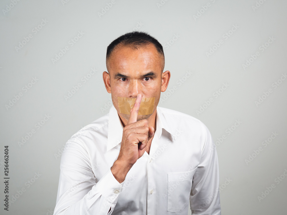 The man making finger on lips silence gesture, pst, shh, The man making finger on lips silence gesture, pst, shh,