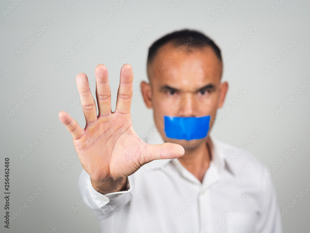 The man showing hand gesture stop sign isolated on white background. The man showing hand gesture stop sign isolated on white background.