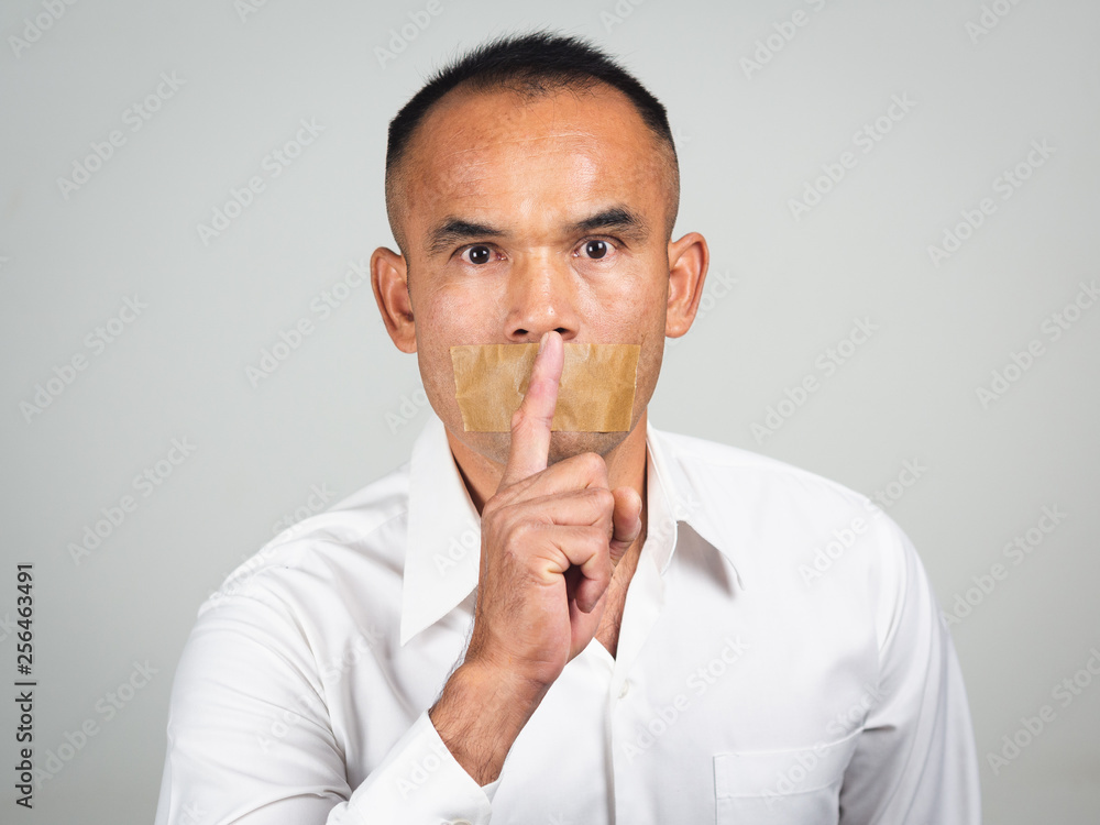 The man making finger on lips silence gesture, pst, shh, The man making finger on lips silence gesture, pst, shh,