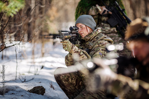 Bild auf Leinwand team of special forces weapons in cold forest