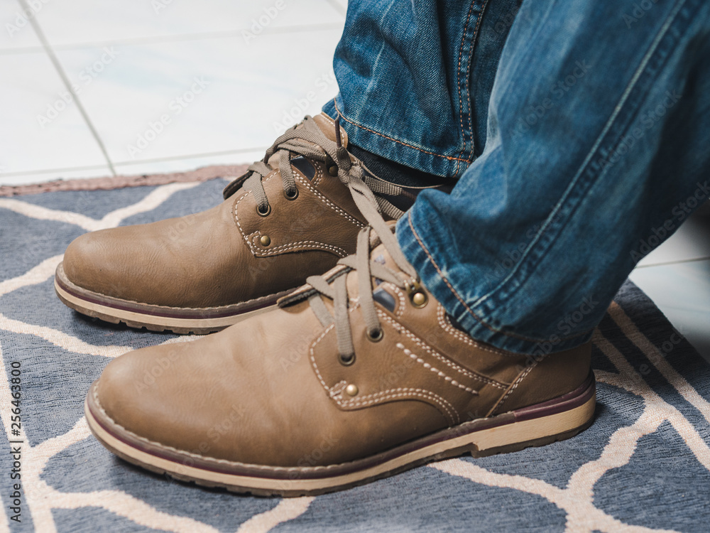 closeup mans shoelaces tied together, April fools day closeup mans shoelaces tied together, April fools day