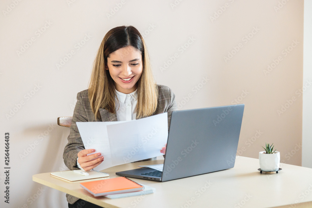 HR manager beautiful woman smiling comparing CV of job candidates HR manager beautiful woman smiling comparing CV of job candidates