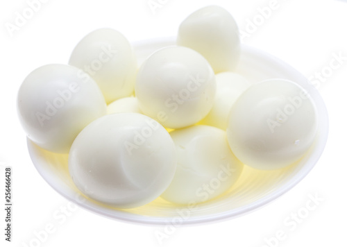 Peeled boiled eggs in a plate on a white background
