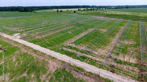 Aerial view of installing solar field pillars construction project. in country.