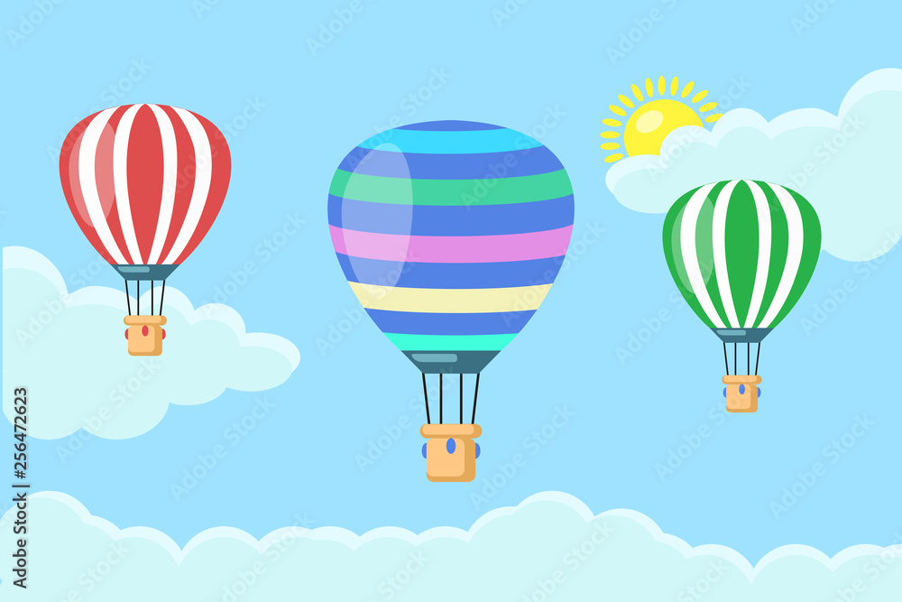 Obraz premium Hot air balloon in the sky with clouds isolated on blue background. Set of aerospace with basket. Flat cartoon design. Vector illustration.