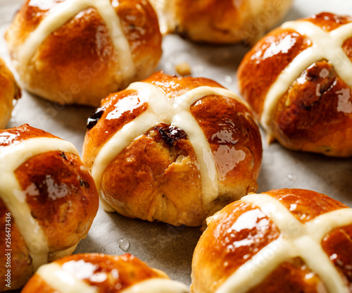 Photography Hot cross buns, freshly baked hot cross buns on white parchment paper