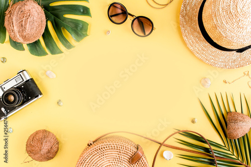 Women's accessories traveler on yellow background with blank space for text. Top view travel or vacation concept. Summer background. Flat lay, top view