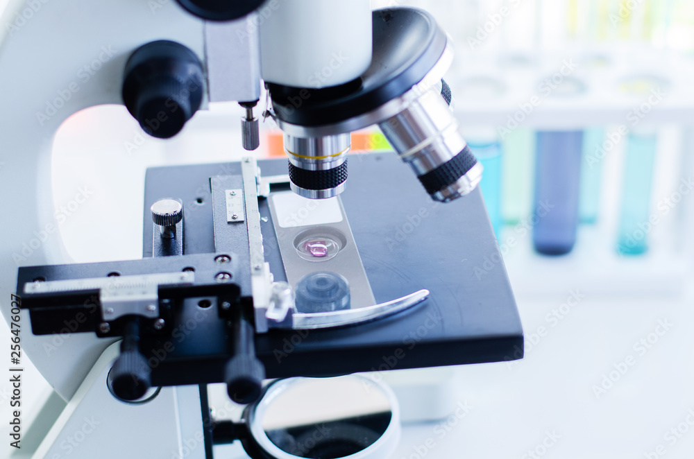 Close-up shot of microscope with metal lens at laboratory. Scientific and healthcare research background. Close-up shot of microscope with metal lens at laboratory. Scientific and healthcare research background.