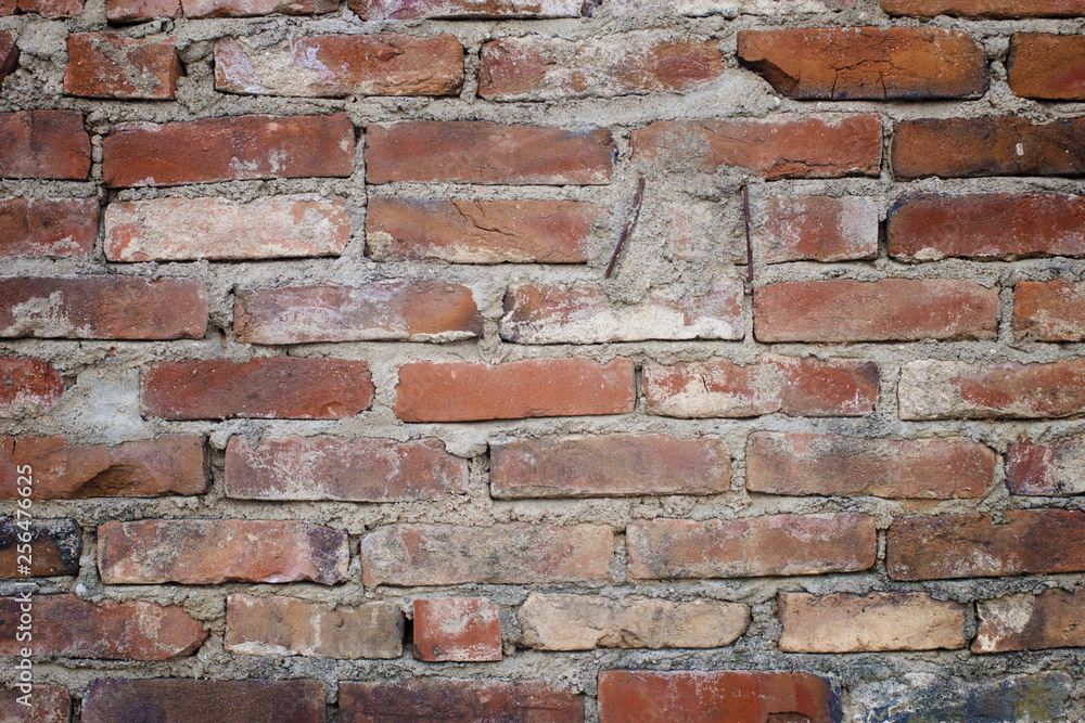 Red brick. Old brick wall, old texture of red stone blocks closeup. Wall texture. Copy space. Red brick. Old brick wall, old texture of red stone blocks closeup. Wall texture. Copy space.