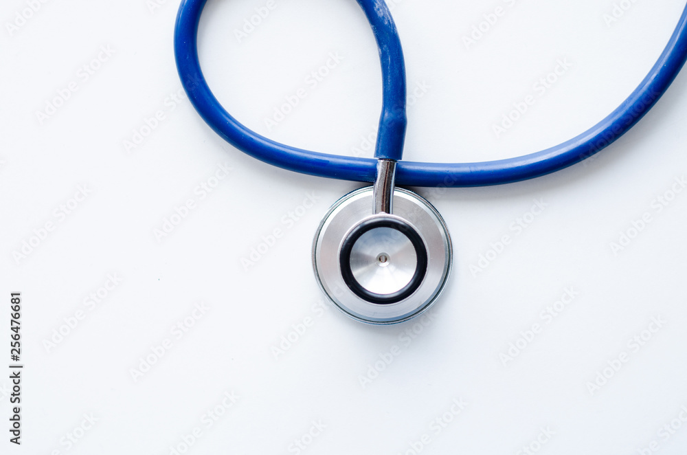 Top view blue stethoscope on yellow background. health background Top view blue stethoscope on yellow background. health background