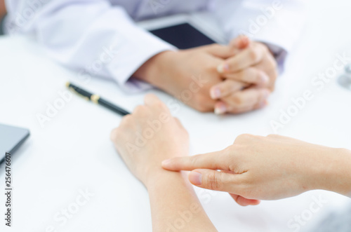 Doctor checking blood pressure of the patient,
