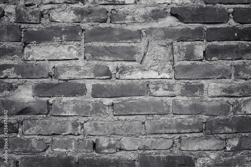 Black and white brick. Old brick wall, old texture of red stone blocks closeup. Wall texture. Copy space.