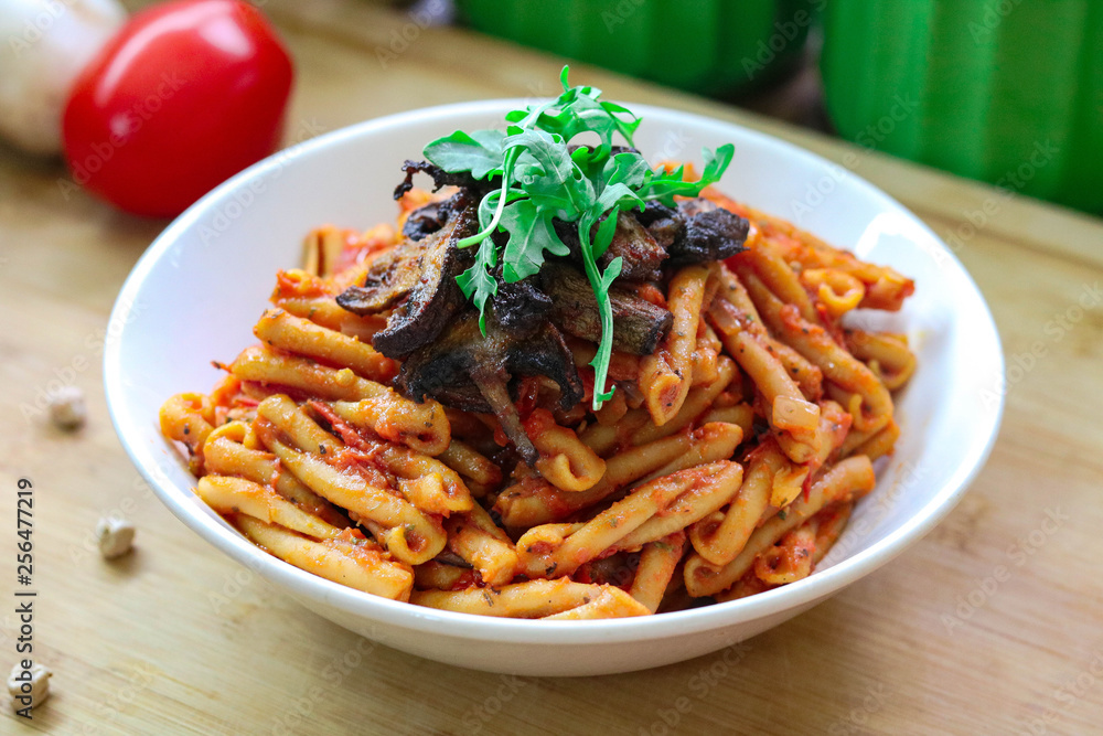 Vegan & Gluten free chickpea pasta with tomato sauce. topped with mushrooms and arugula. Vegan & Gluten free chickpea pasta with tomato sauce. topped with mushrooms and arugula.