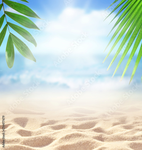 Sand with Palm and tropical beach bokeh background  Summer vacation and travel concept. Copy space