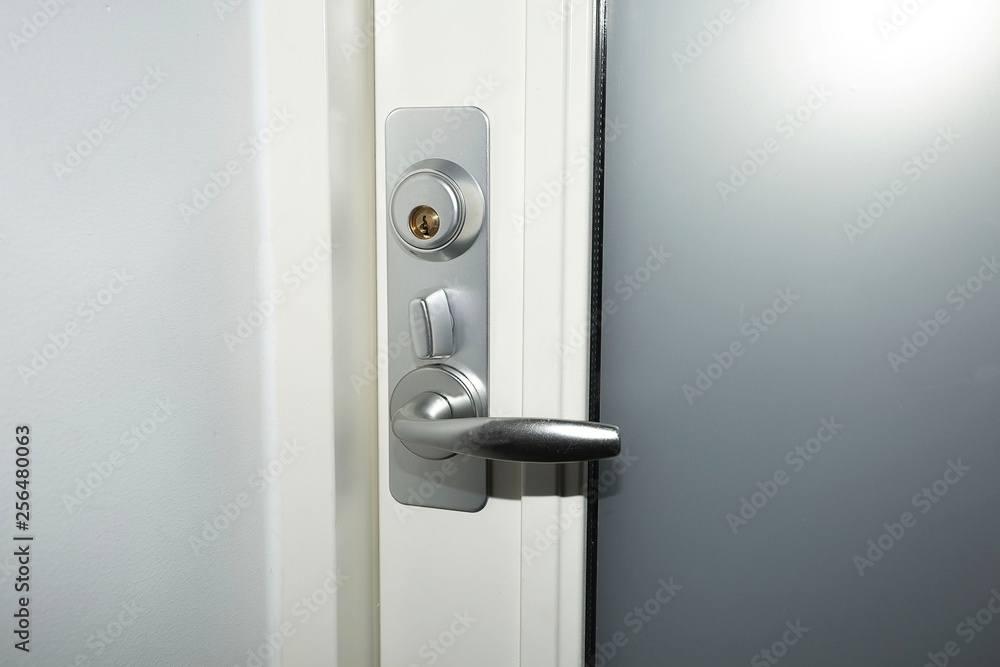 Close up view of lock on white door. Interior design. Beautiful backkgrounds. Close up view of lock on white door. Interior design. Beautiful backkgrounds.