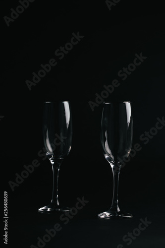 two glasses on black background