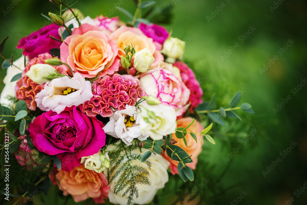Fototapeta premium wedding table with floral arrangement prepared for reception, wedding, birthday or event centerpiece 