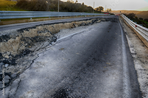 Asphalt road destroyed by the landslide 