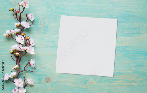 White flowers on blue woode...