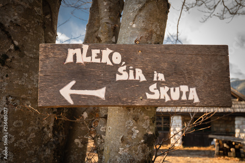 'milk, cheese and fresh cheese' wooden sign written in slovenian language
