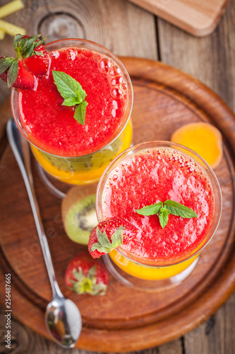 Smoothies with fresh fruit. Strawberries, apricots, kiwi.