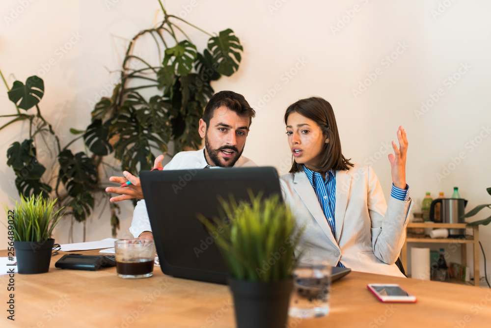 Young business people discussing projects in the casual office. Business meeting concept. Young business people discussing projects in the casual office. Business meeting concept.