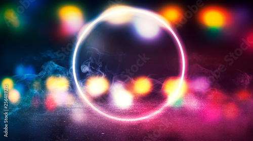 Background of empty stage, room. Reflection on wet pavement, concrete. Neon blurry lights. Neon circle figure in the center, smoke
