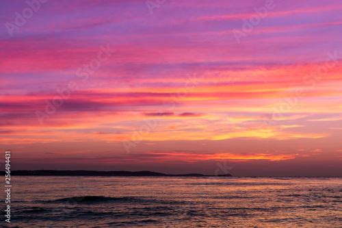 Beautiful yellow purple red sky at sunset over the sea