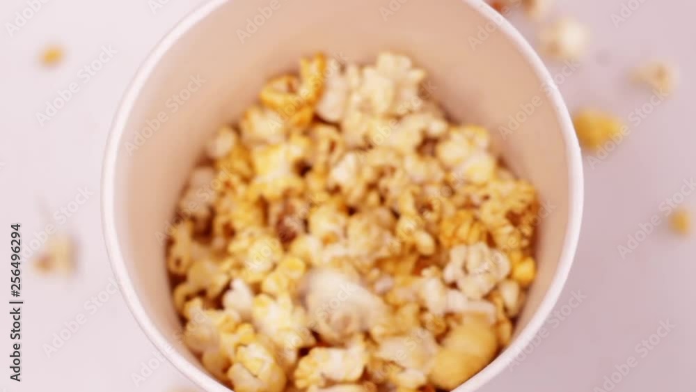 Popcorn being served closeup Popcorn being served closeup