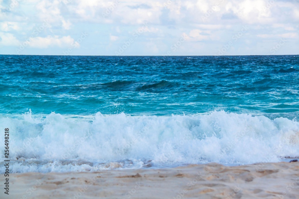 Bermuda. Turquoise water of Atlantic ocean and blue sky. Fantastic view on beach. Beautiful background.