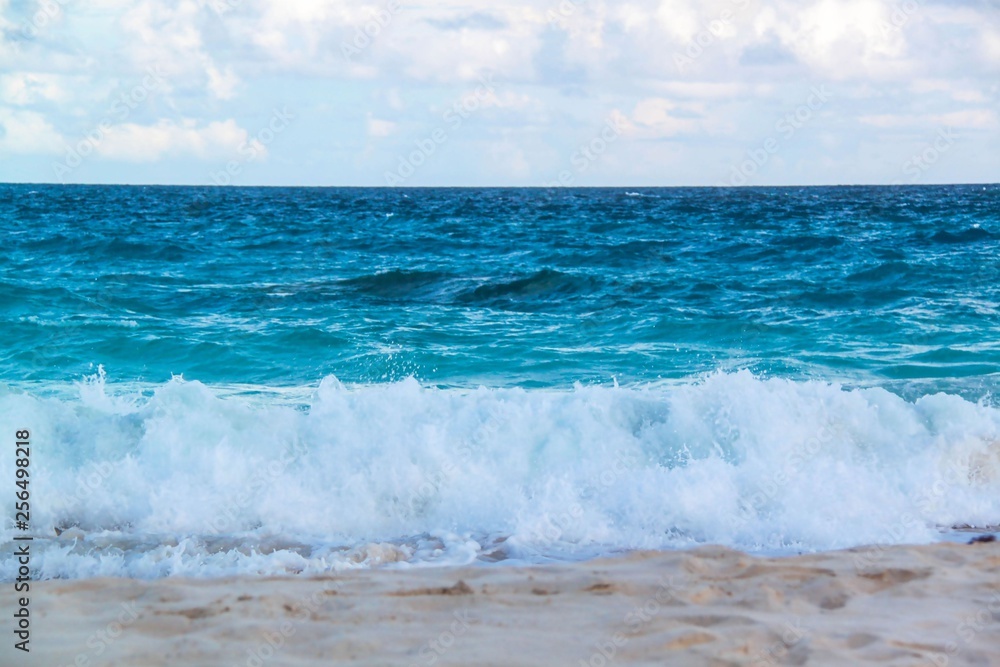 Bermuda. Turquoise water of Atlantic ocean and blue sky. Fantastic view on beach. Beautiful background. Bermuda. Turquoise water of Atlantic ocean and blue sky. Fantastic view on beach. Beautiful background.