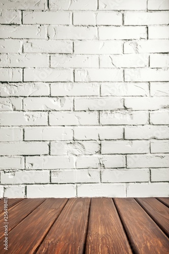 Studio background. White brick wall and wood floor.