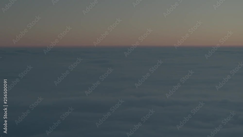 Aerial drone view of sunrise over clouds high over mountains Aerial drone view of sunrise over clouds high over mountains