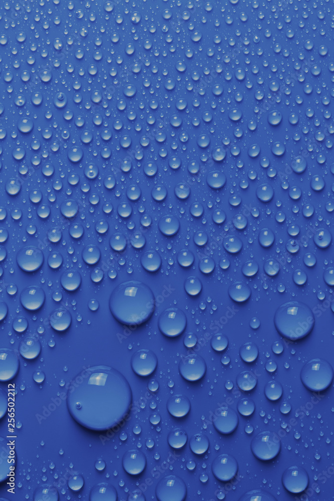 Light blue surface with clear water drops, background