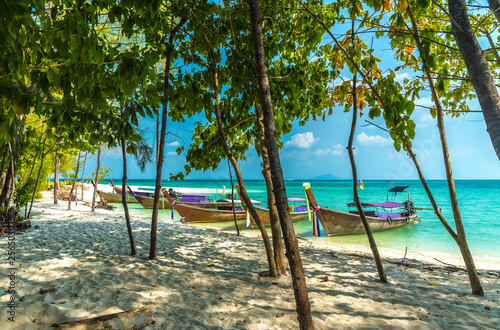 Beautiful tropical beach and traditional thai boats, Poda island in Thailand, Krabi province, tourist tour.