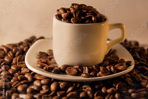 Fragrant roasted coffee beans brown and cup