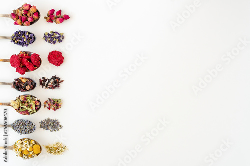 Фотография Variety of tea in  spoons, isolated on white