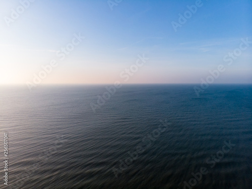 Curonian Spit and the Baltic Sea. View from the copter. Coastline with the beach and the sea. Nature conservation. View from the sky. The photo was taken by drone quadcopter.