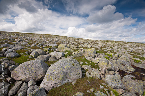 Rocky landscape with beautiful clouds in blue sky