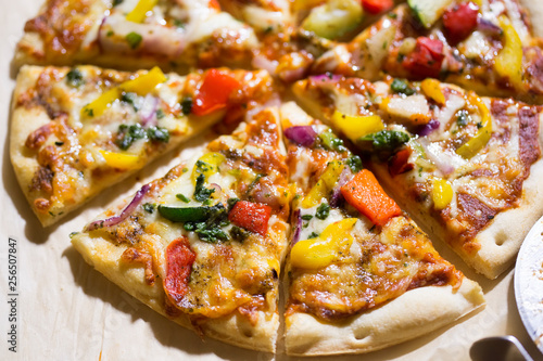 Pizza with grilled vegetables: courgette, peppers, red onion & green pesto