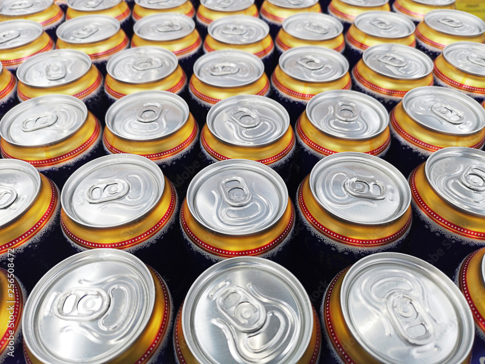 Pattern from much of drinking cans of beer. Metal beer cans background. Drink cans Pattern from much of drinking cans of beer. Metal beer cans background. Drink cans
