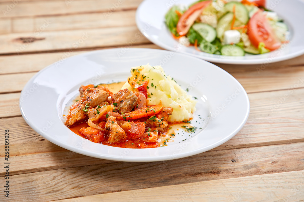 chicken with mashed potatoes and salad on the wooden background chicken with mashed potatoes and salad on the wooden background