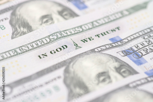 In god we trust sentence on 100 dollar banknote close up view. In God We Trust from the 100 dollar bill