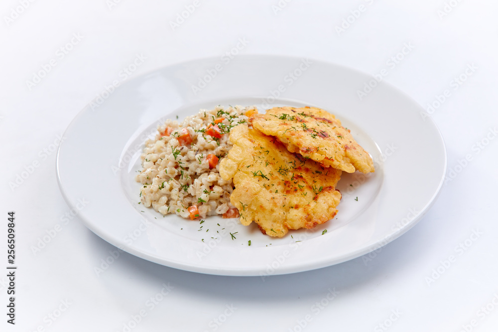 fried chicken breast with barley on the white background fried chicken breast with barley on the white background